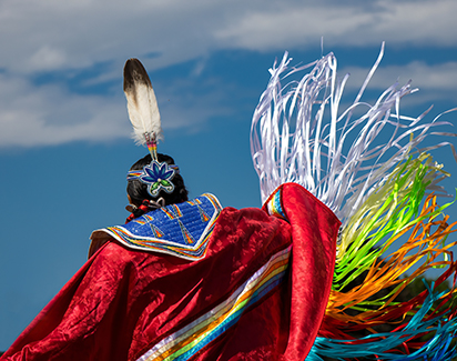 raditional Indigenous regalia with colorful ribbon details representing the communities served by AFN Insurance Brokers across Canada.