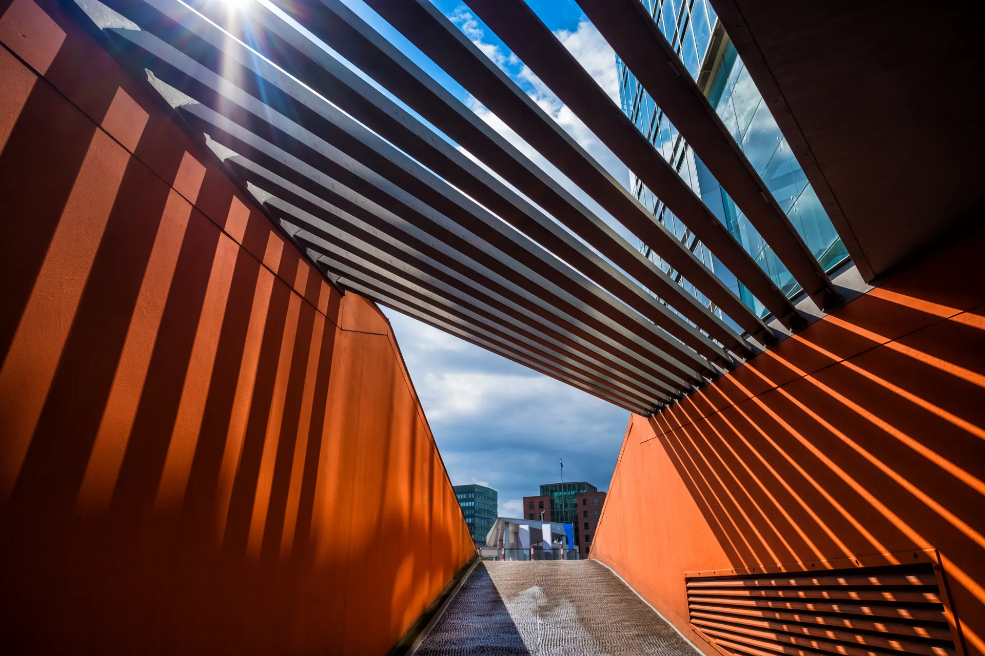 Modern architectural walkway with bold geometric lines representing Alliant Underwriting Services and innovative insurance solutions.